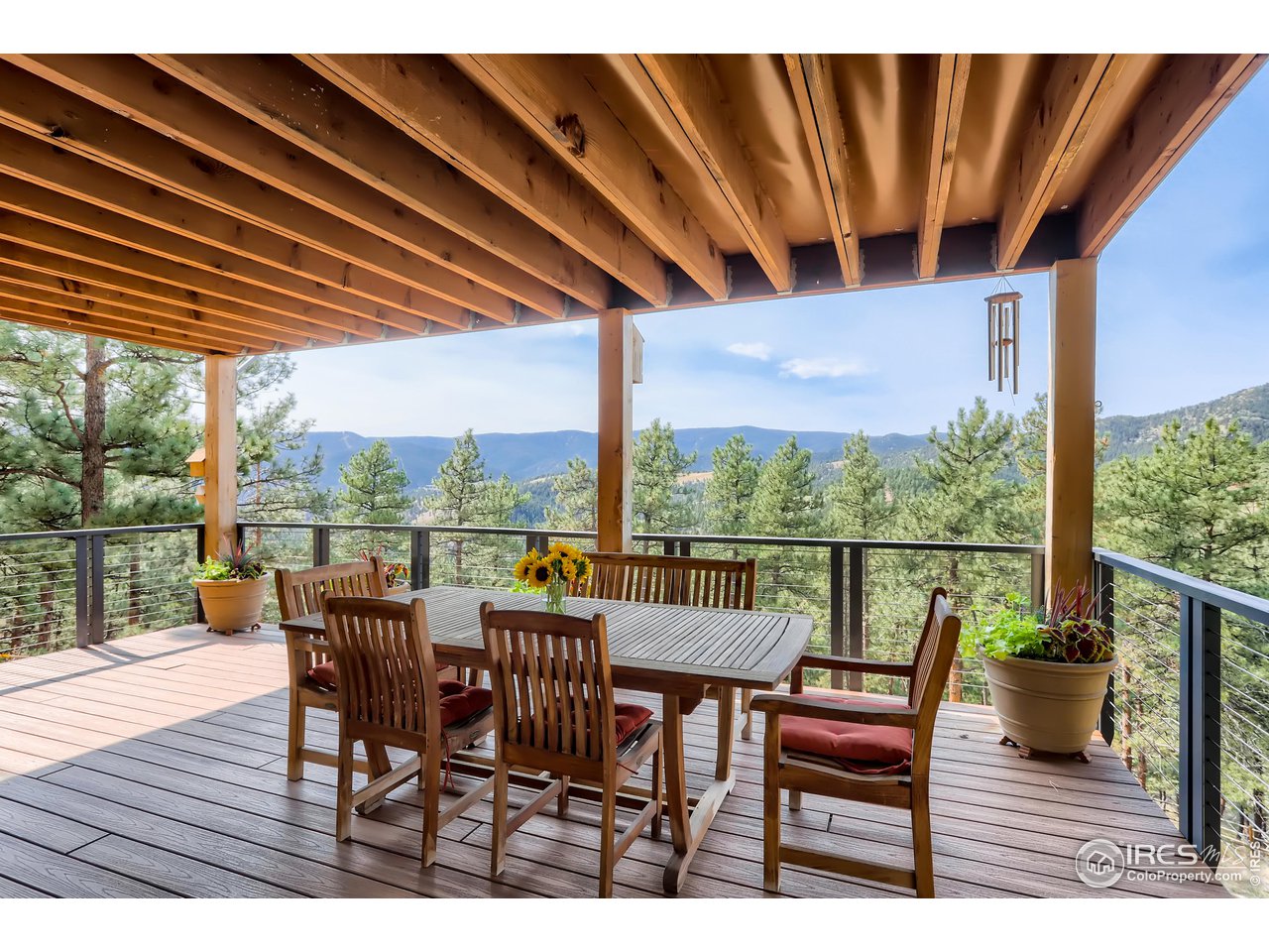 153 Poorman Road Boulder, CO 80302 - Photo 37 of 40 a view of a chairs and table in patio with a barbeque grill
