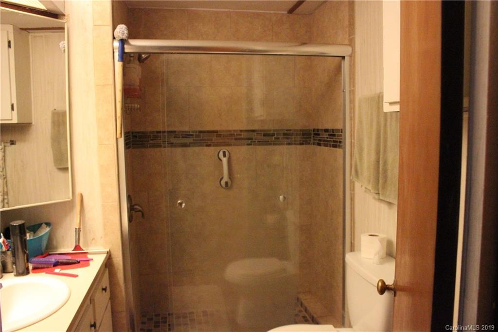 2856 Filbert Highway Clover, SC 29710 - Photo 8 of 11 a bathroom with a granite countertop shower and a sink