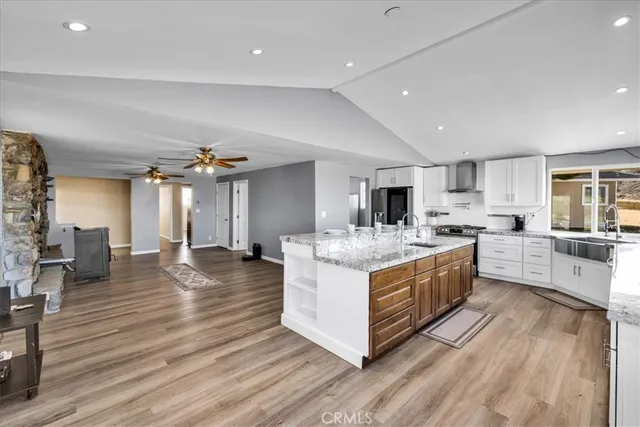 a large bedroom with a large bed and a large window