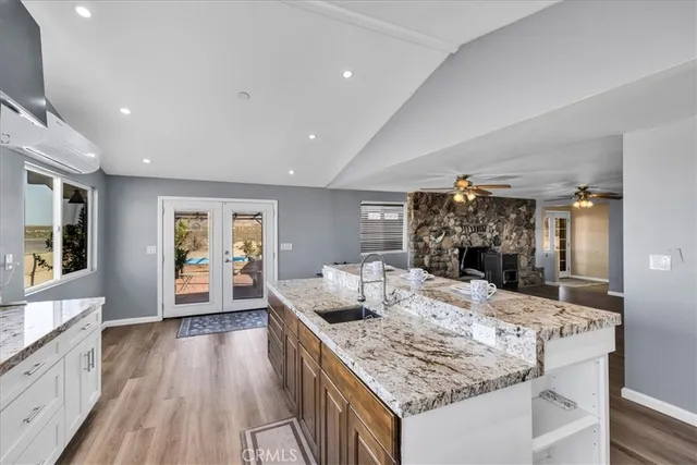 a view of kitchen with furniture and refrigerator