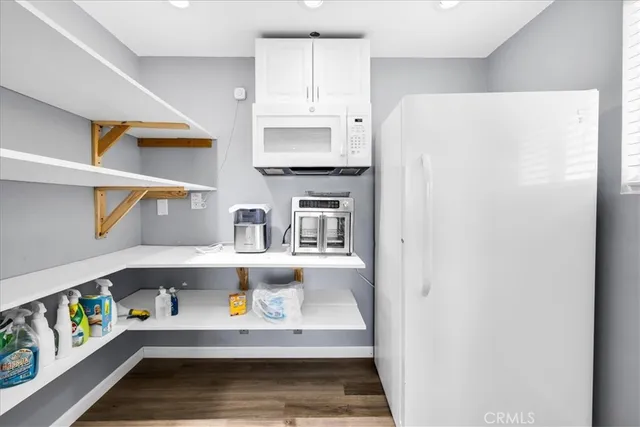 a bathroom with a sink toilet and mirror