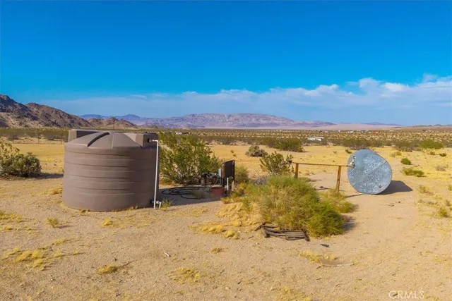 a view of a lake with furniture