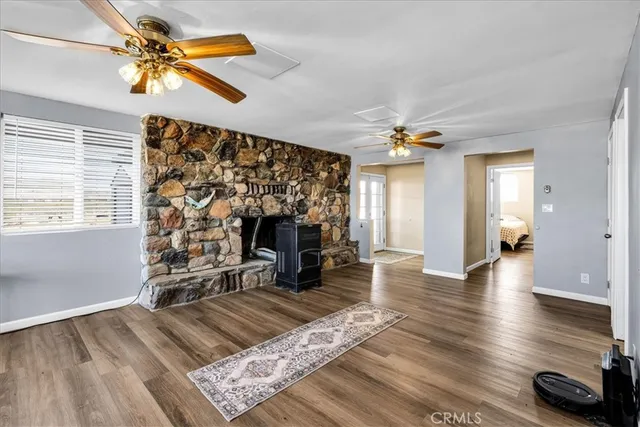 a kitchen with white cabinets and window