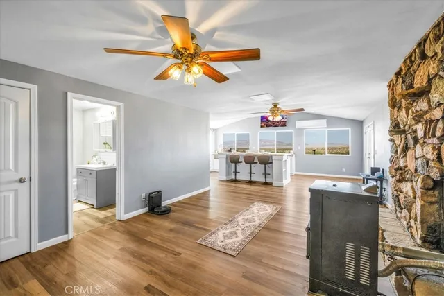 a kitchen with stainless steel appliances granite countertop a sink and cabinets