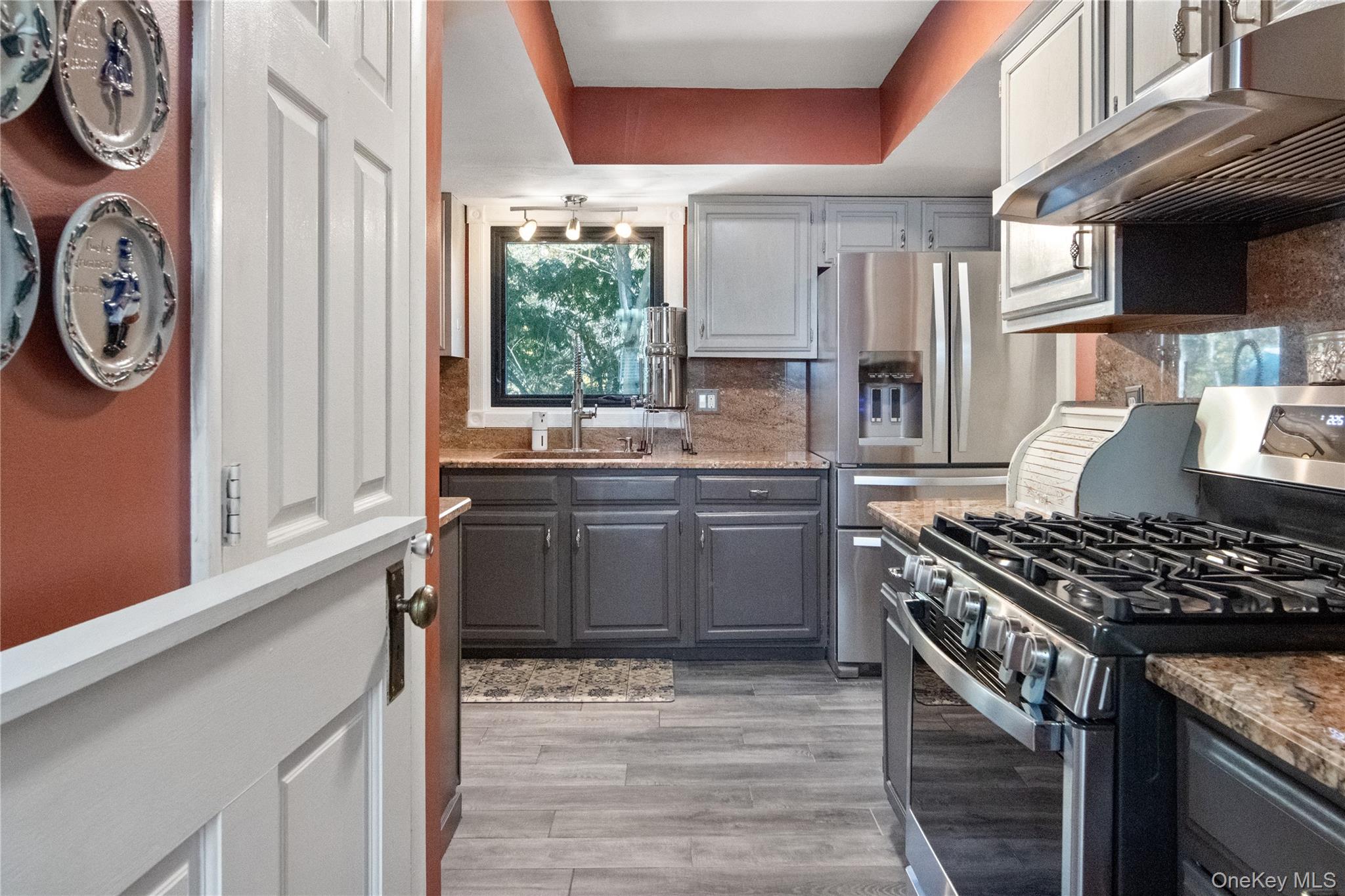 12 Chapel Road Newburgh, NY 12550 - Photo 13 of 46 a kitchen with stainless steel appliances granite countertop a stove and a refrigerator