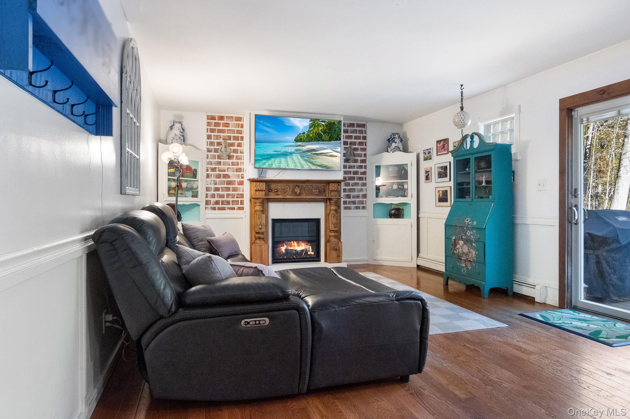 12 Chapel Road Newburgh, NY 12550 - Photo 16 of 46 a living room with furniture and a fireplace