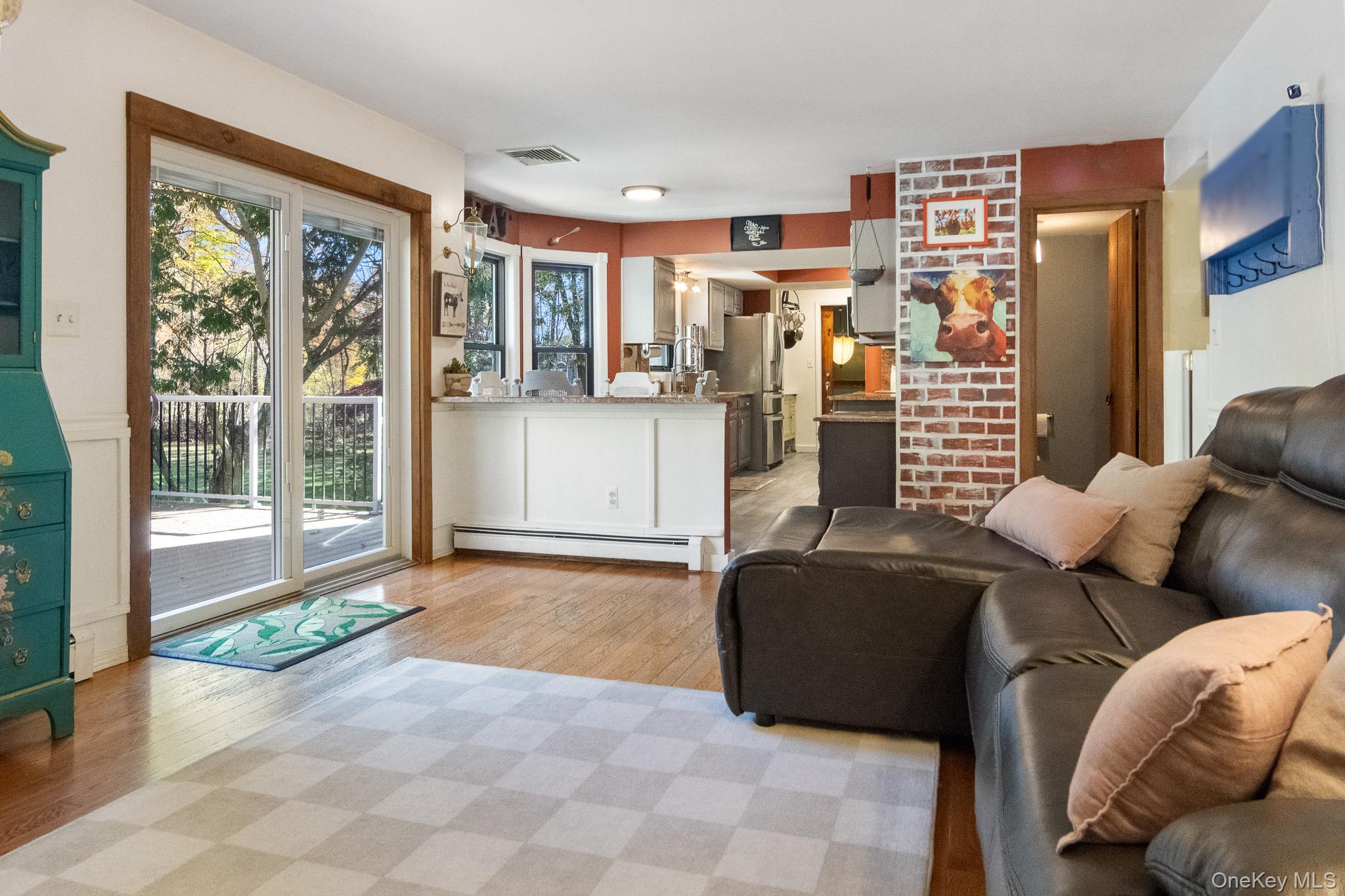 12 Chapel Road Newburgh, NY 12550 - Photo 17 of 46 a living room with furniture and a floor to ceiling window