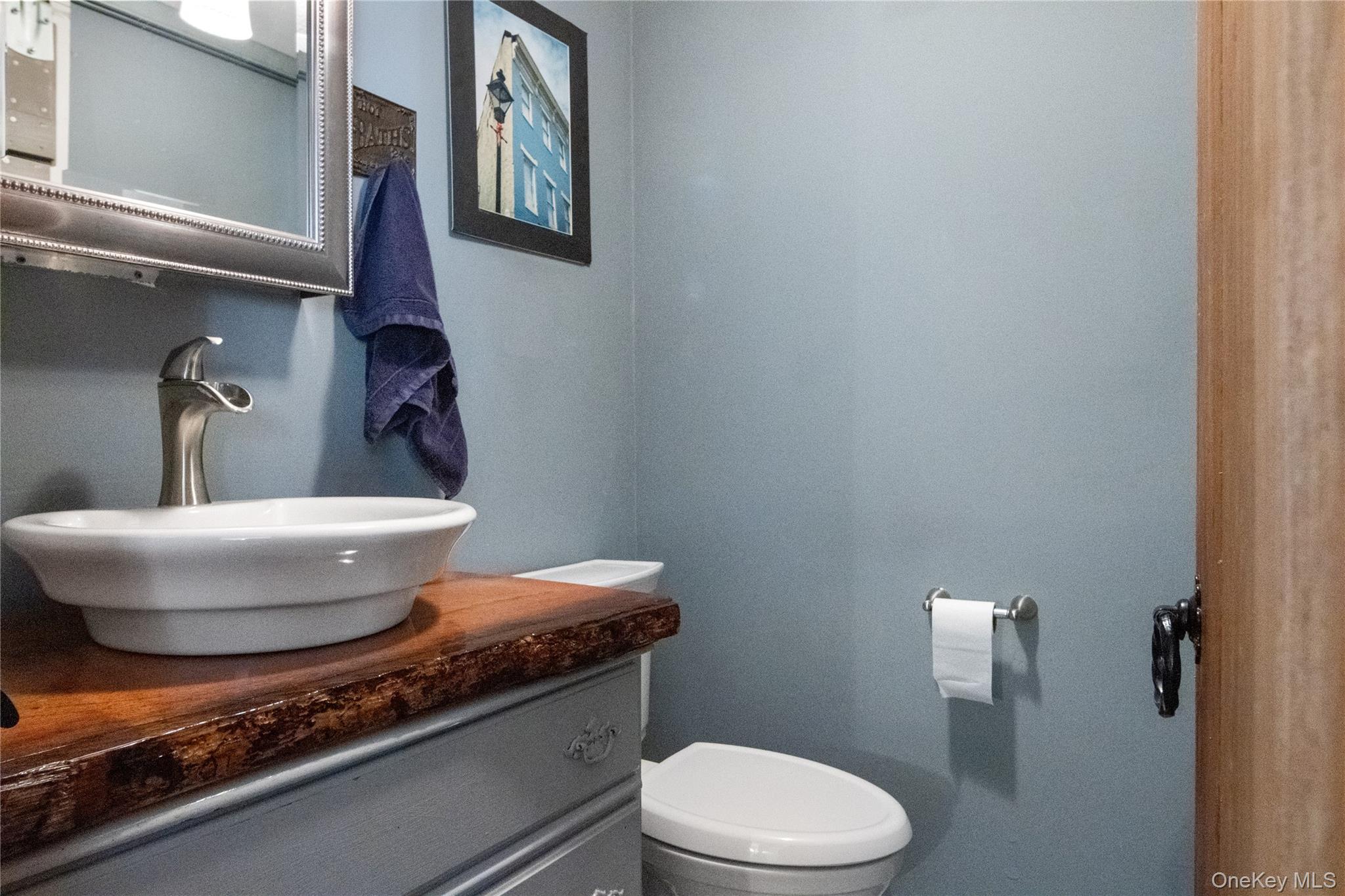 12 Chapel Road Newburgh, NY 12550 - Photo 18 of 46 a bathroom with a toilet and a mirror