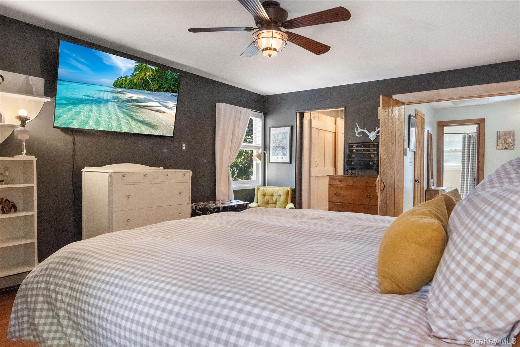 12 Chapel Road Newburgh, NY 12550 - Photo 21 of 46 a bedroom with a large bed and a chandelier