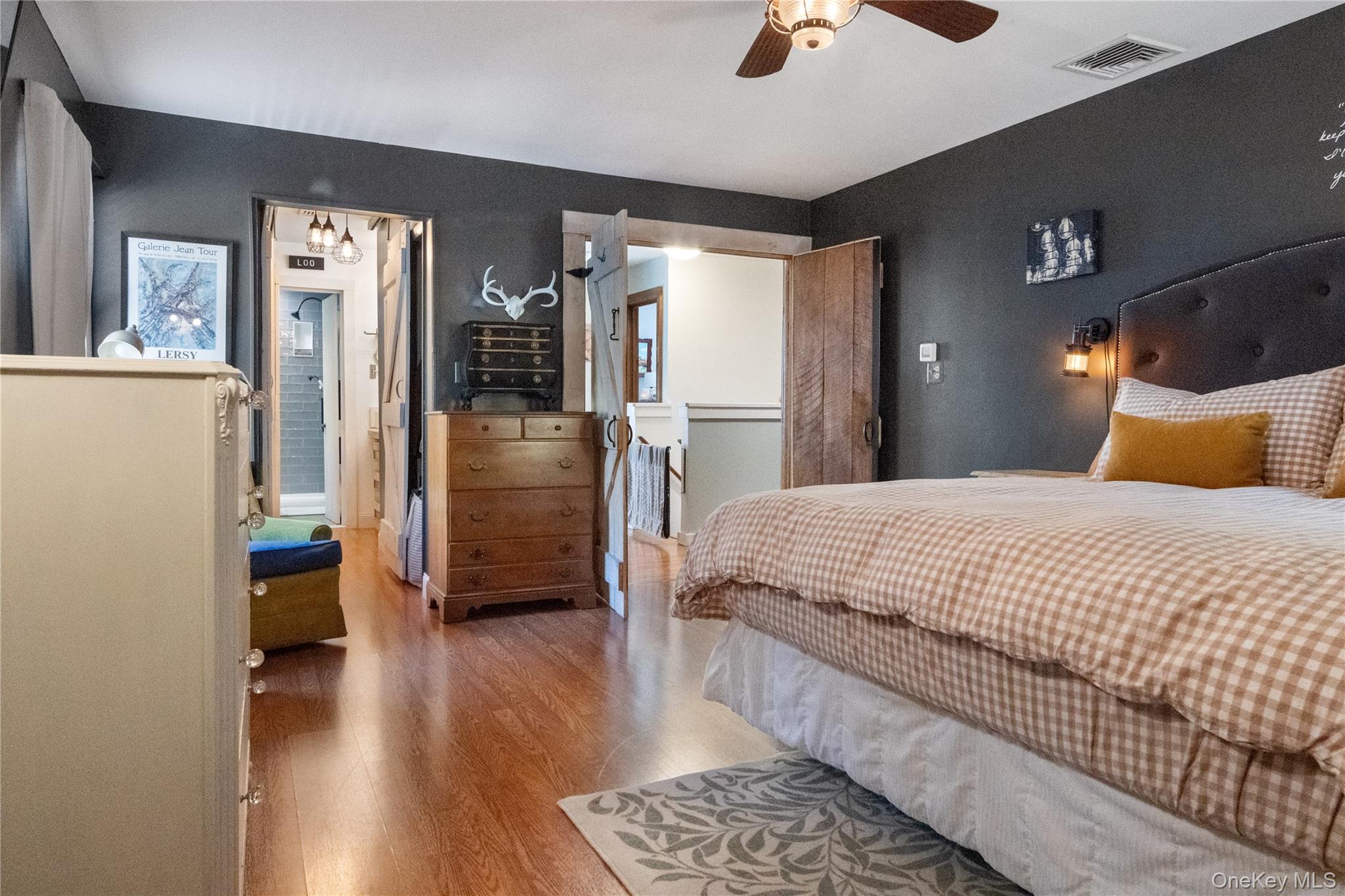 12 Chapel Road Newburgh, NY 12550 - Photo 22 of 46 a bedroom with a bed and a chandelier