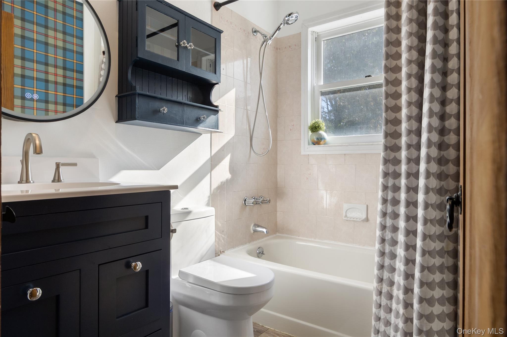 12 Chapel Road Newburgh, NY 12550 - Photo 28 of 46 a bathroom with a sink a toilet and bathtub