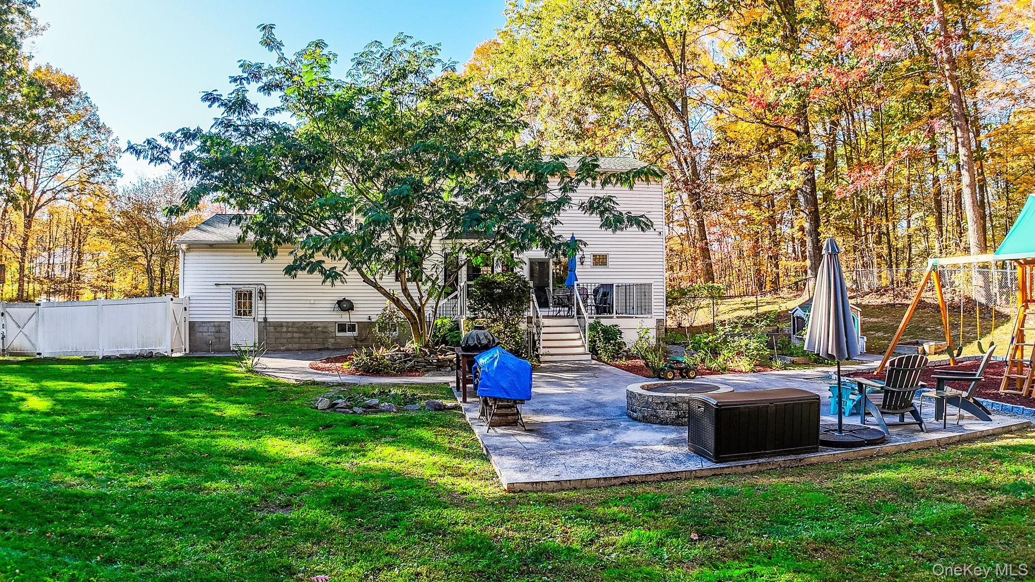 12 Chapel Road Newburgh, NY 12550 - Photo 34 of 46 a front view of a house with garden and trees