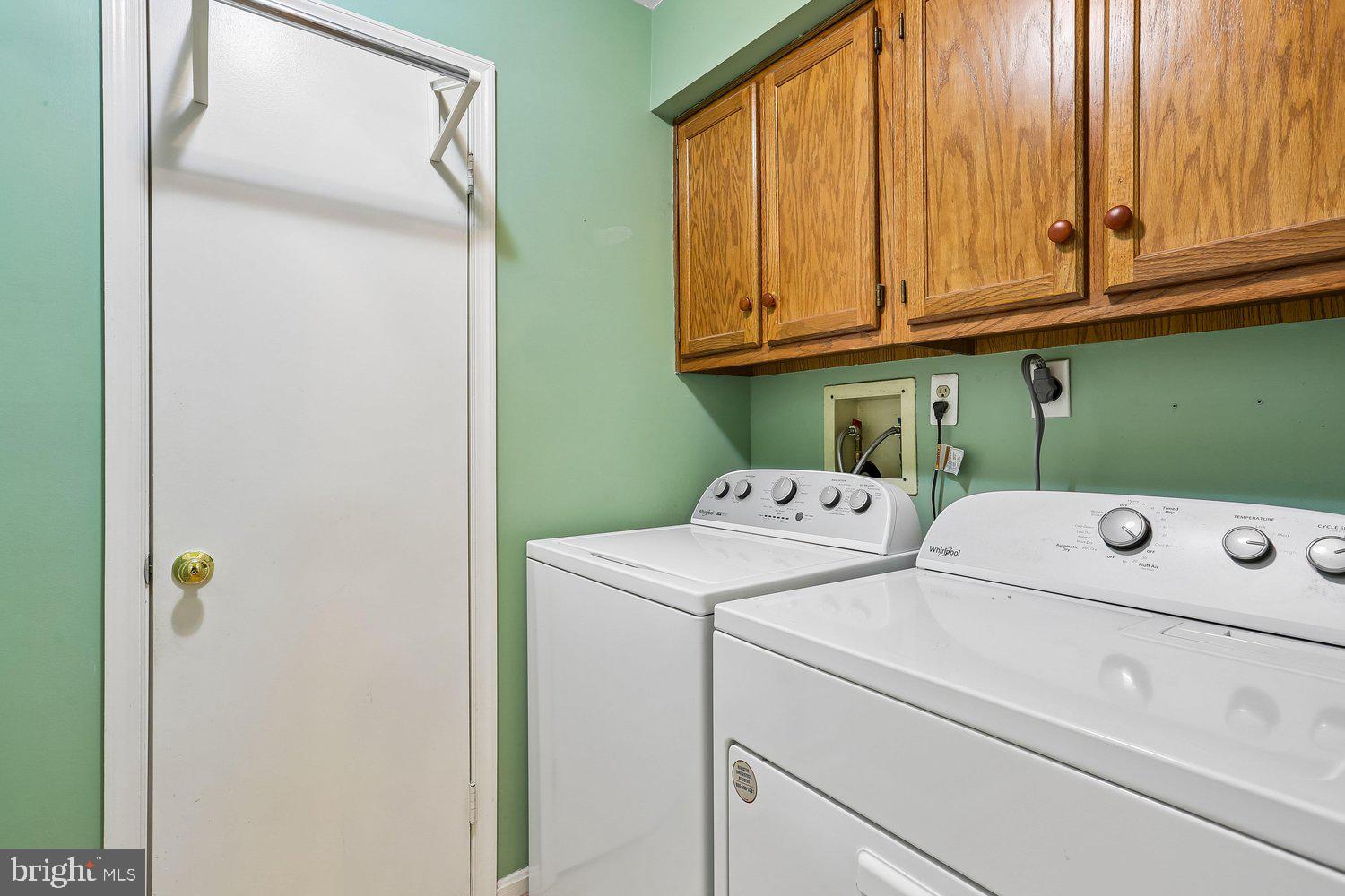 14822 Rose Trellis Place Silver Spring, MD 20906 - Photo 22 of 65 a utility room with dryer and washer