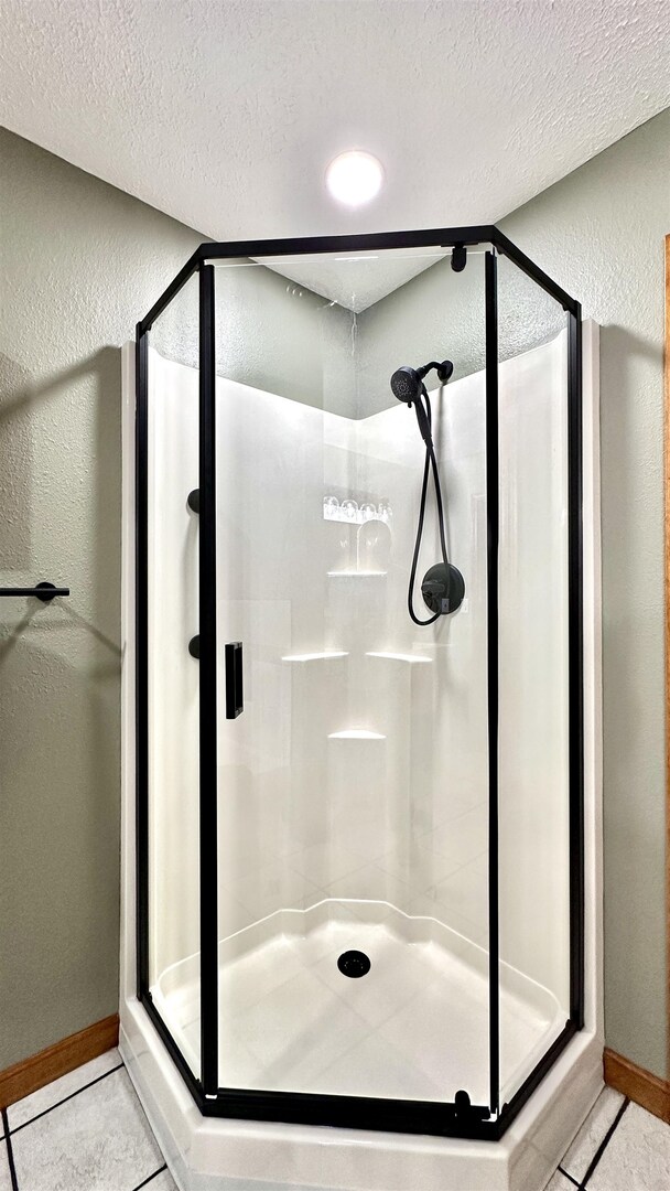 1111 East Elm Street West Frankfort, IL 62896 - Photo 20 of 27 a bathroom with a glass shower door