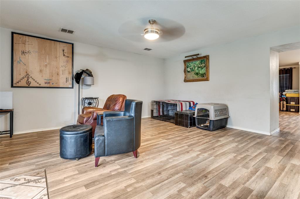 4254 Birch Creek Road Fort Worth, TX 76244 - Photo 12 of 25 a living room with furniture and a wooden floor