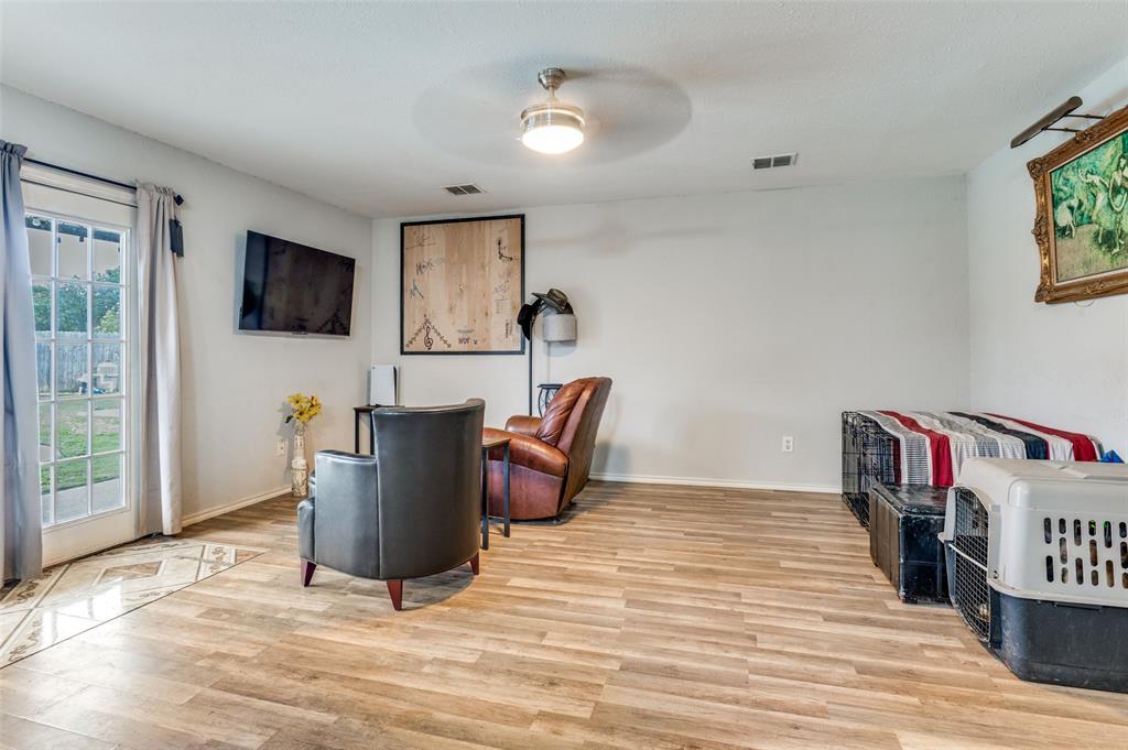 4254 Birch Creek Road Fort Worth, TX 76244 - Photo 13 of 25 a living room with furniture and a flat screen tv