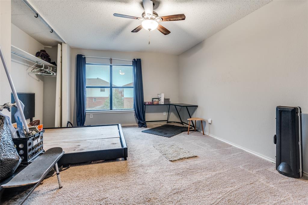 4254 Birch Creek Road Fort Worth, TX 76244 - Photo 19 of 25 a bedroom with furniture and a window