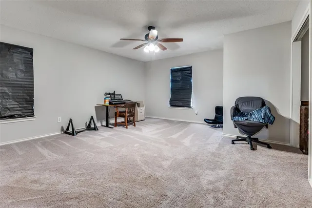 a bedroom with furniture and a window