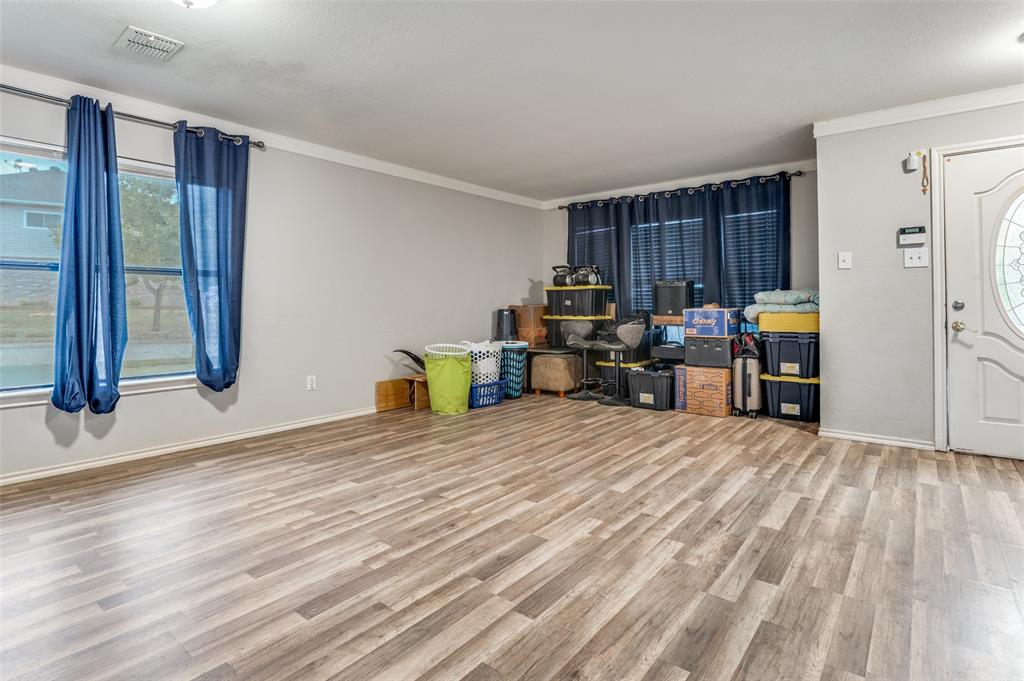 4254 Birch Creek Road Fort Worth, TX 76244 - Photo 4 of 25 a view of a room with furniture and wooden floor