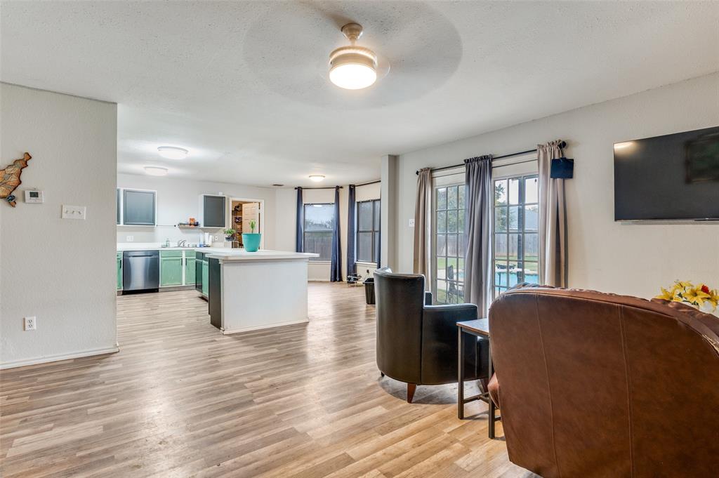 4254 Birch Creek Road Fort Worth, TX 76244 - Photo 7 of 25 a living room with furniture and a flat screen tv
