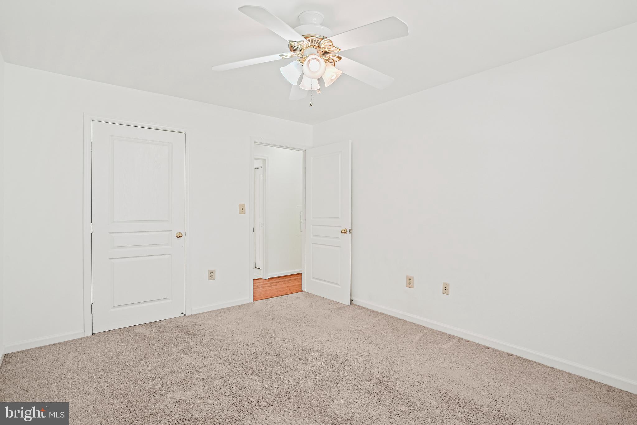 5565 Seminary Road, Unit 113 Falls Church, VA 22041 - Photo 13 of 19 a view of an empty room with a chandelier fan