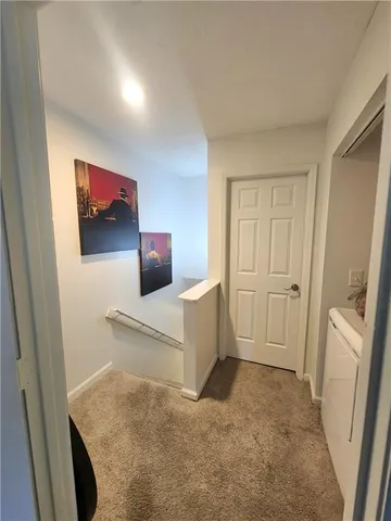 a living room with a couch and a flat screen tv