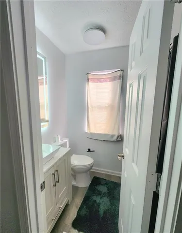 a bathroom with a sink toilet a shower and a mirror