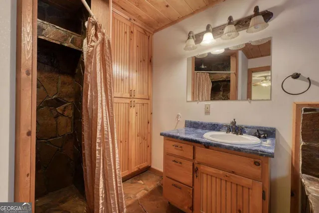 a bathroom with a bathtub and shower