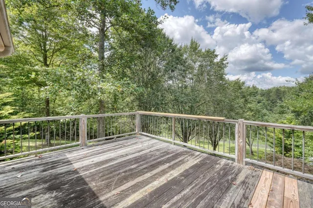 a view of balcony with deck and wooden floor