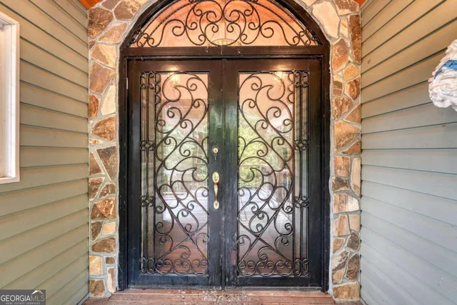 a door with a door and a wooden bench