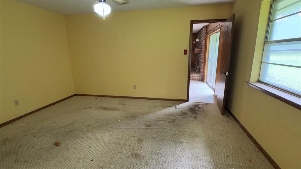 415 Meadowlark Trail Springtown, TX 76082 - Photo 11 of 35 a view of a room with a empty space