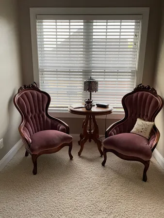 a work room with furniture and a window