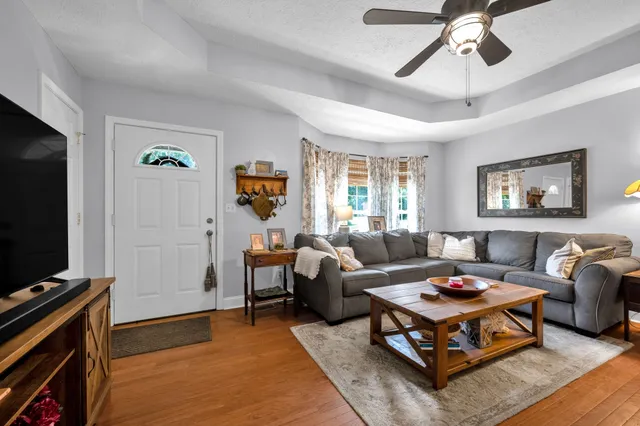 a living room with furniture and a flat screen tv