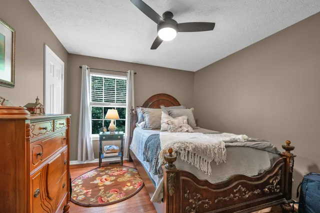 a living room with hard wood floor and furniture