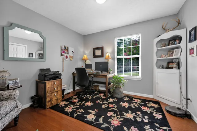 a bathroom with a sink mirror and toilet