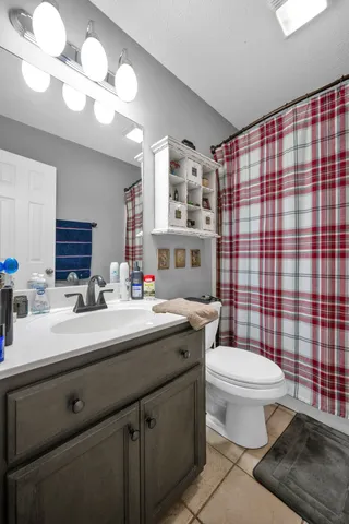 view of a room with bed and wooden floor