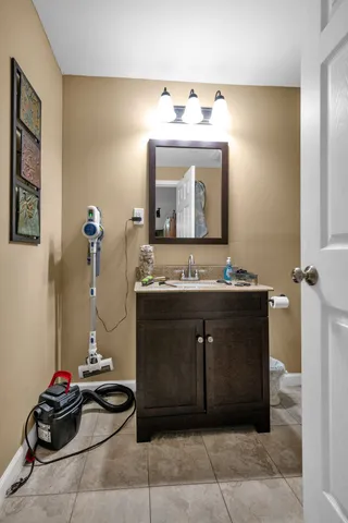a view of a roof deck with table and chairs and wooden floor