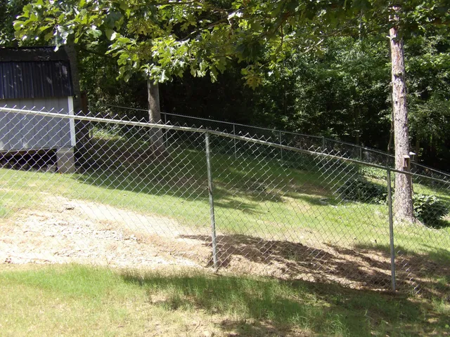 a front view of a house with a yard table and chairs