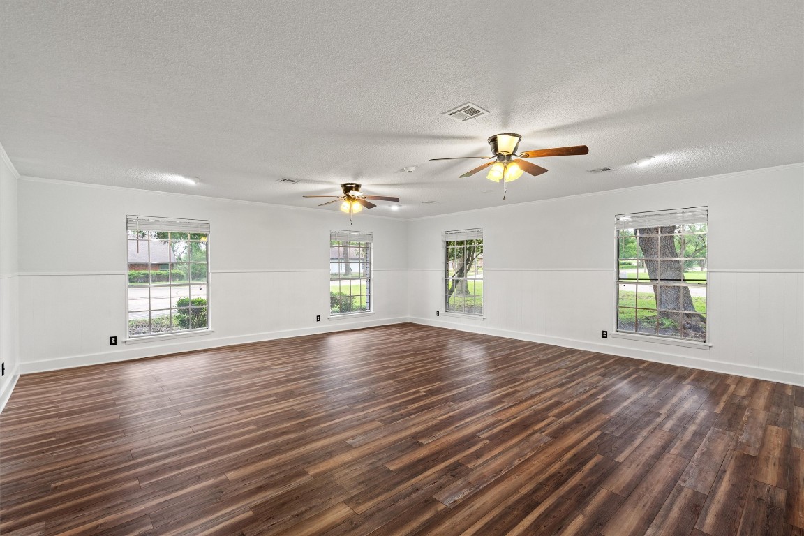 4101 Briar Cliff Road Temple, TX 76502 - Photo 19 of 40 a view of an empty room with a window and wooden floor