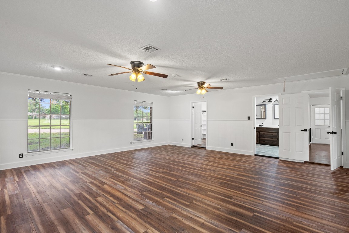4101 Briar Cliff Road Temple, TX 76502 - Photo 21 of 40 a view of empty room with wooden floor and ceiling fan