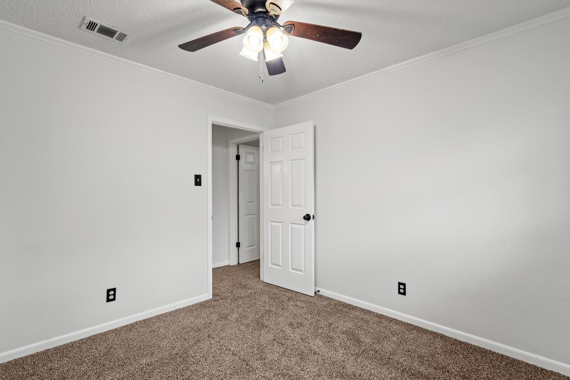 4101 Briar Cliff Road Temple, TX 76502 - Photo 32 of 40 an empty room with chandelier fan