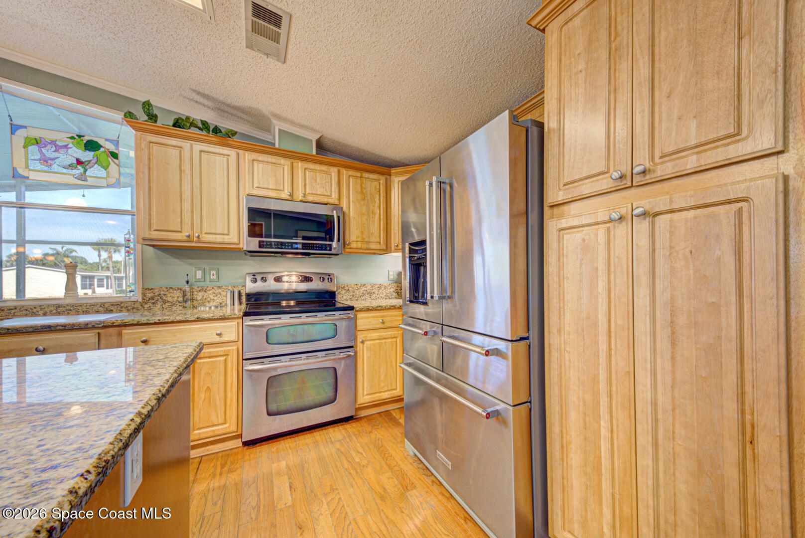 176 Woodsmill Boulevard, Unit 177 Cocoa, FL 32926 - Photo 12 of 63 10 kitchen with stainless appliances