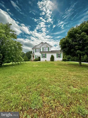 a view of a house with a big yard