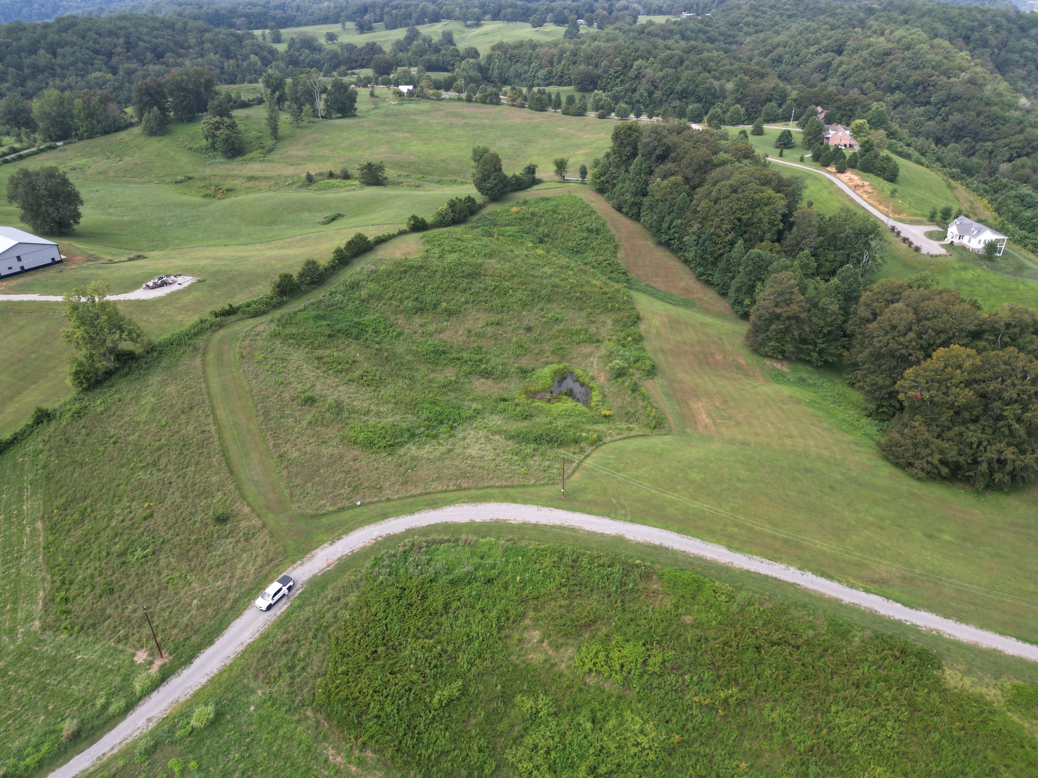 a view of a lake with a yard