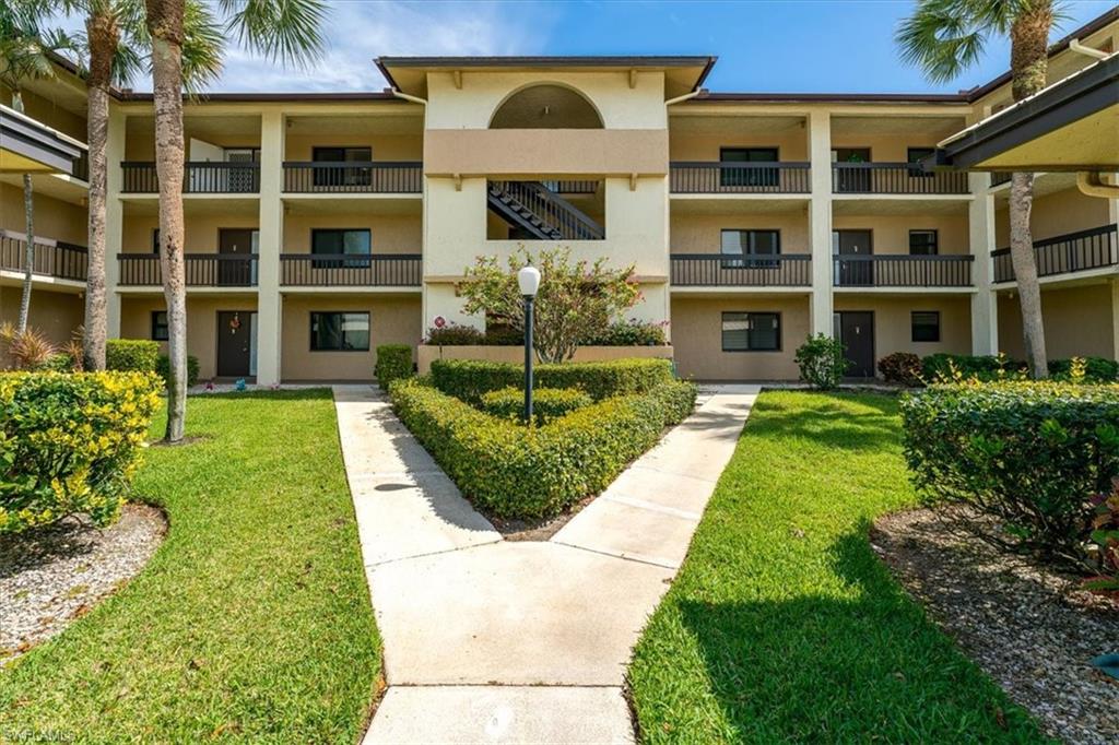 75 St Andrews Boulevard, Unit C301 Naples, FL 34113 - Photo 39 of 41 a view of a house with a garden