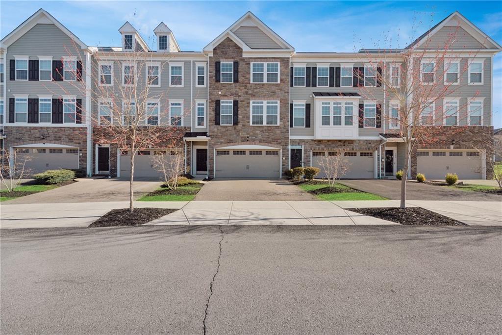 204 Eagle Drive Cranberry Township, PA 16066 - Photo 1 of 34 a house with a garden and wooden fence