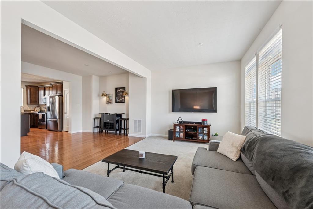 204 Eagle Drive Cranberry Township, PA 16066 - Photo 11 of 34 a living room with furniture and a flat screen tv