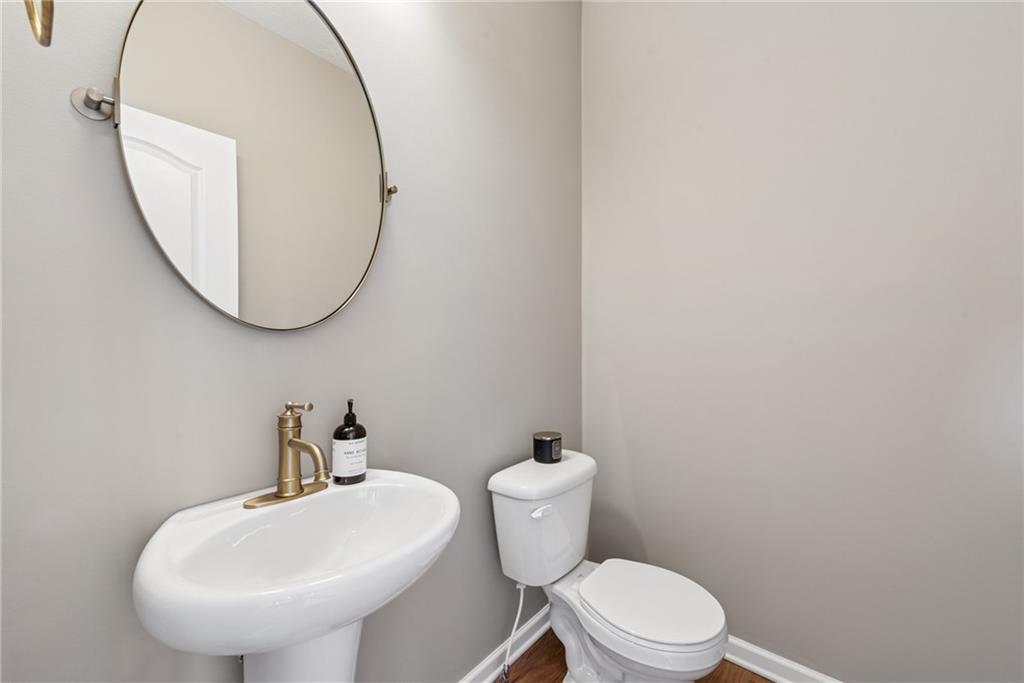 204 Eagle Drive Cranberry Township, PA 16066 - Photo 15 of 34 a bathroom with a toilet a sink and a mirror