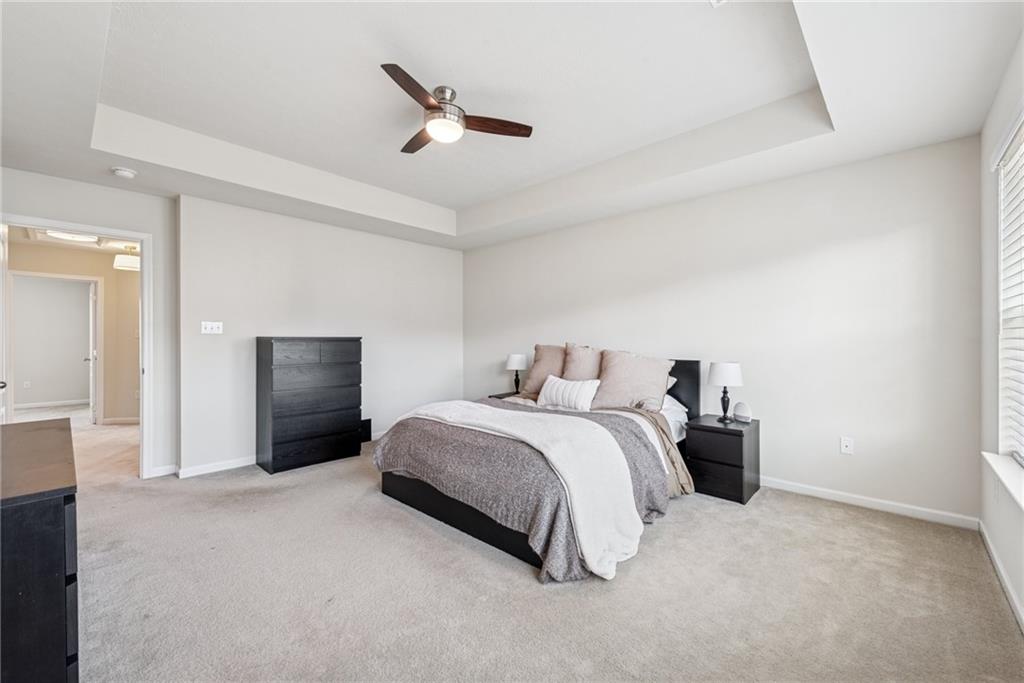 204 Eagle Drive Cranberry Township, PA 16066 - Photo 17 of 34 a spacious bedroom with a bed and a ceiling fan