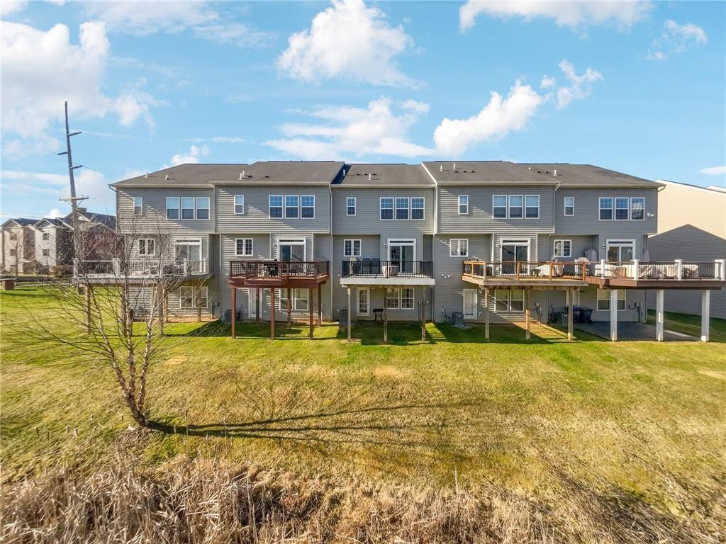 204 Eagle Drive Cranberry Township, PA 16066 - Photo 33 of 34 a view of a swimming pool with an outdoor seating